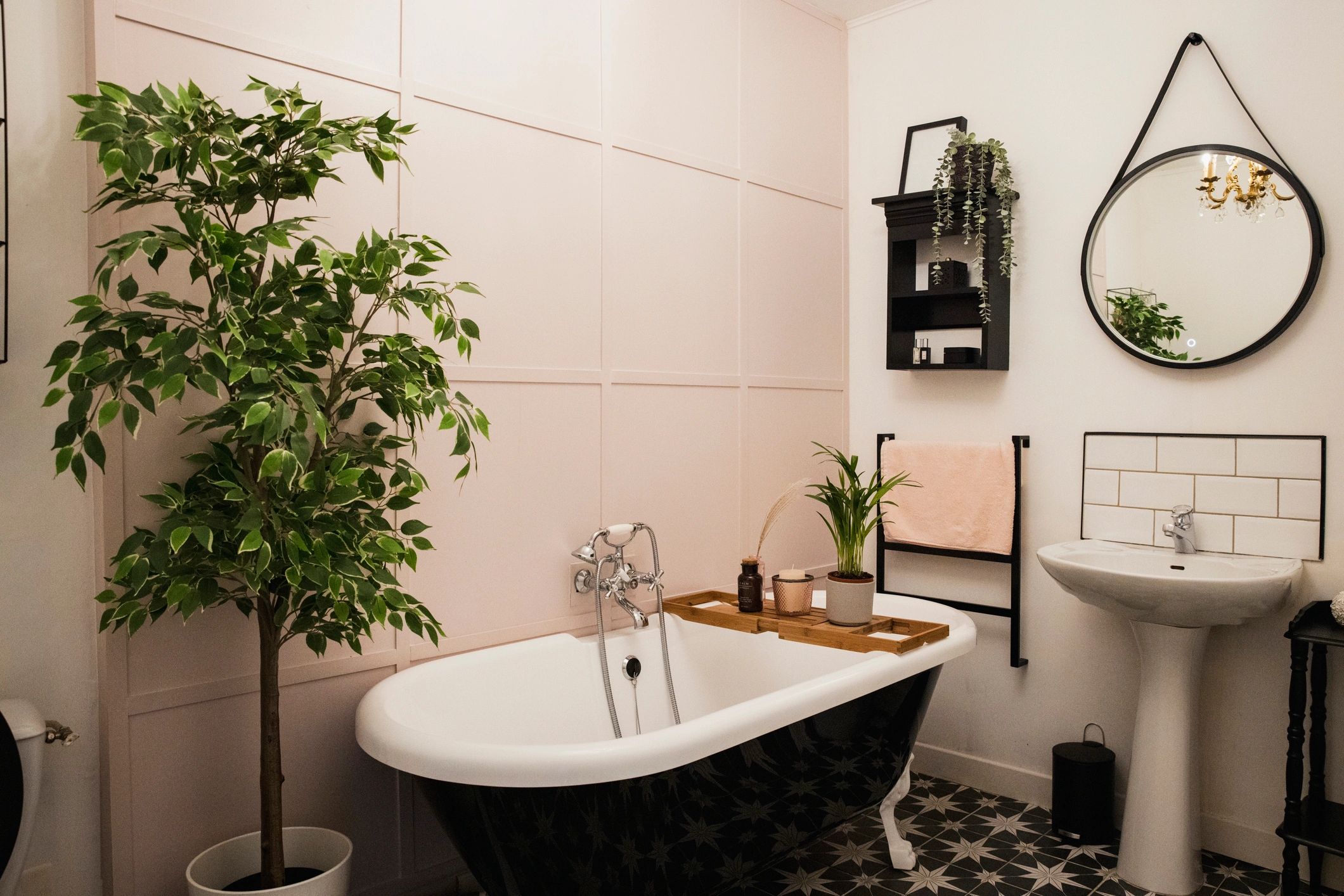 Modern bathroom with plants and clean tile surfaces