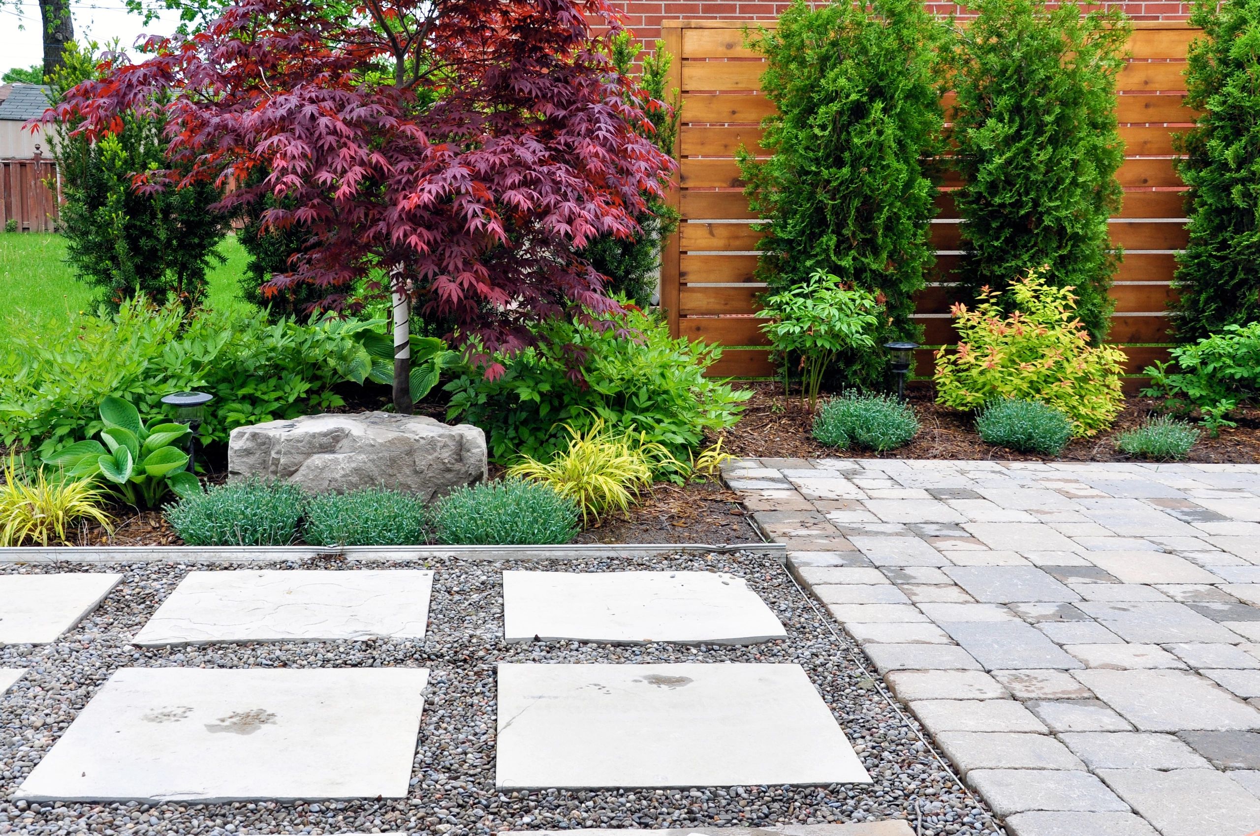Detailed view of a paver patio with clean joints and modern landscaping