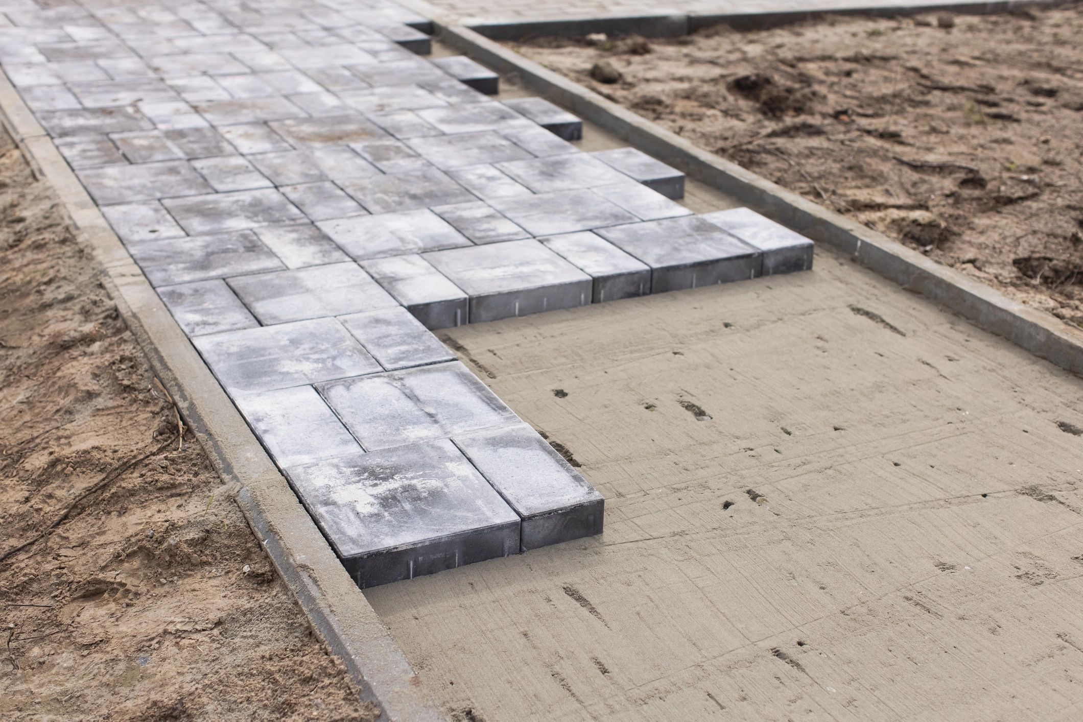 Freshly laid patio tiles in progress