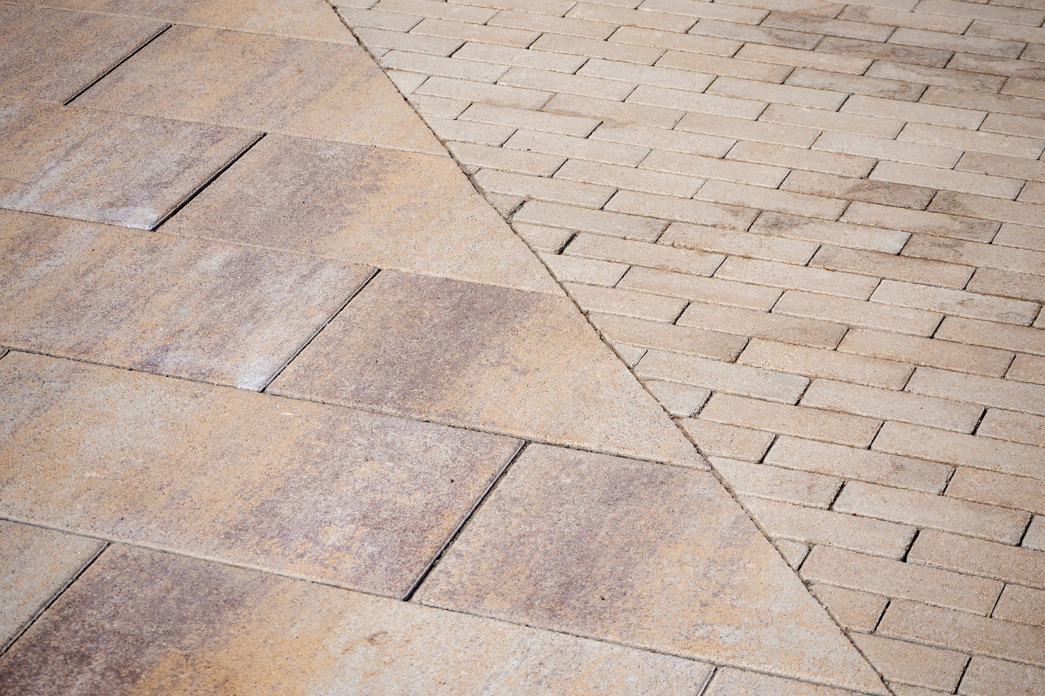 Diagonal meeting of two paver patterns with clean joints