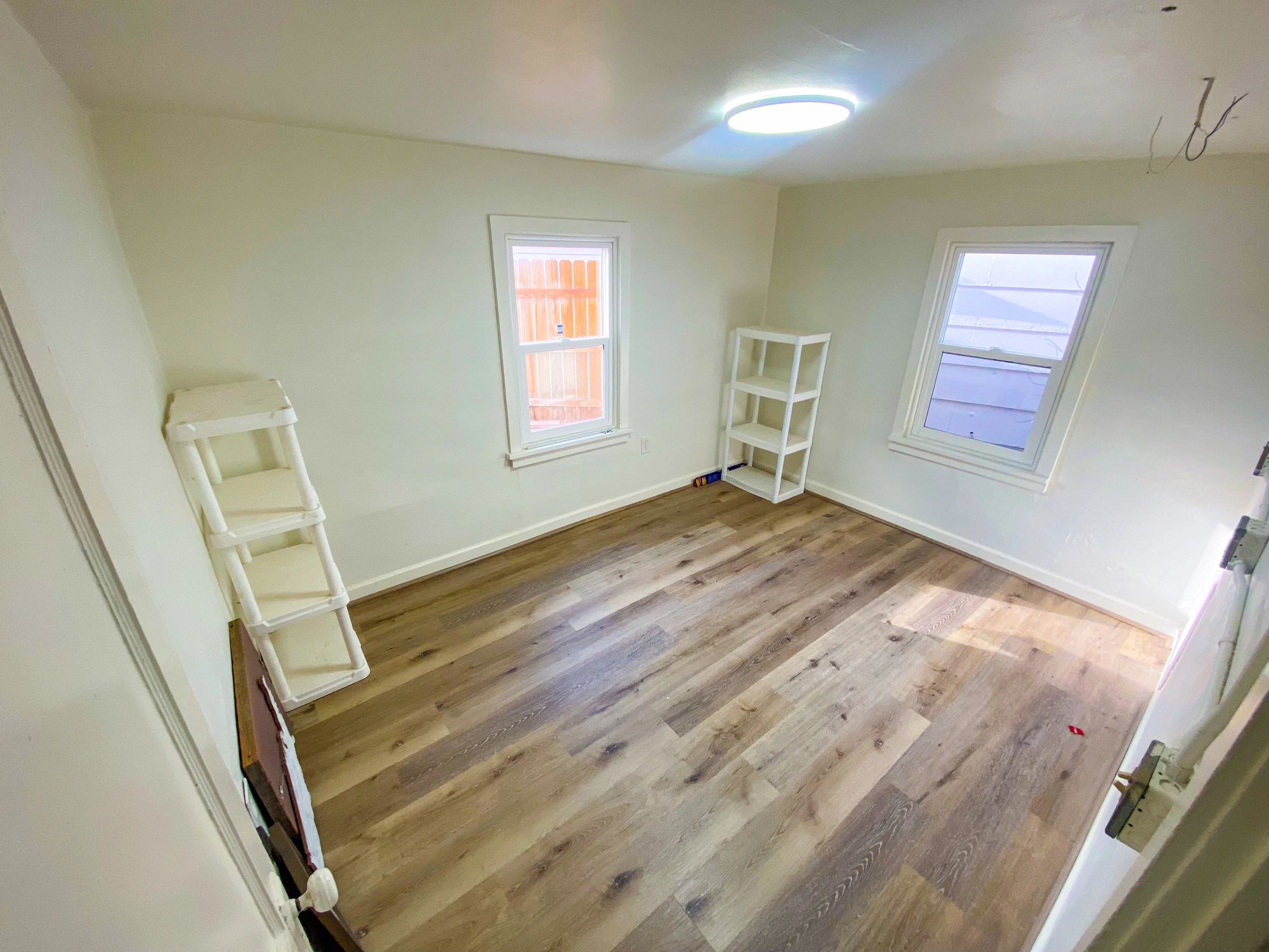 Bright bedroom interior with finished flooring