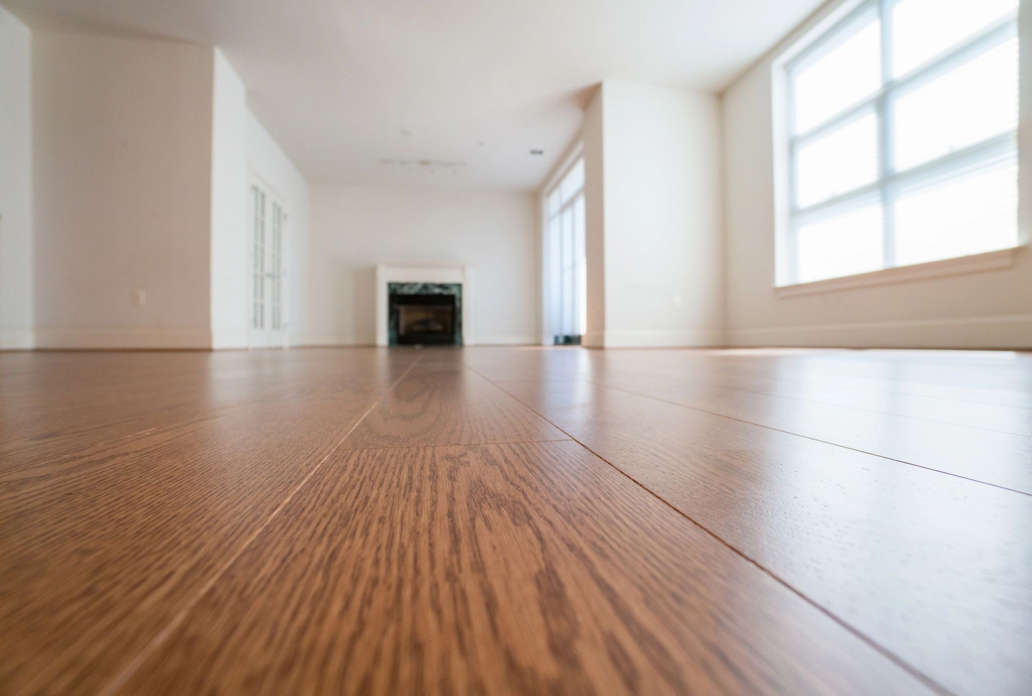 Empty apartment interior with newly installed oak floors