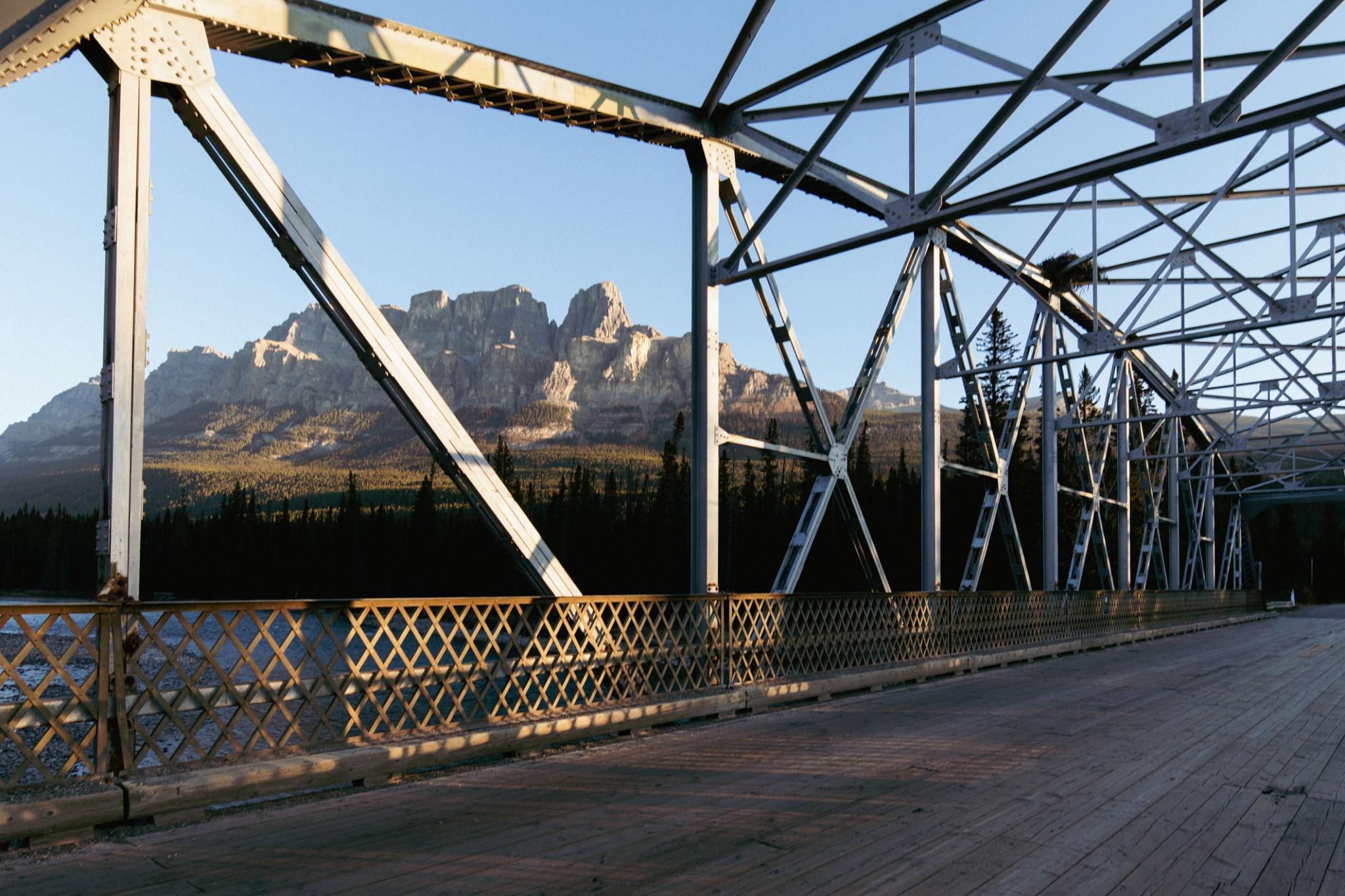 Bridge over river at sunset